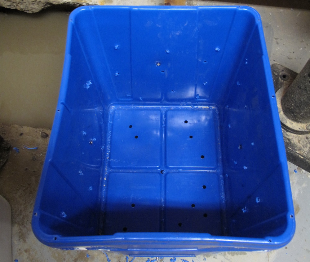recycling bins as sump pit basin with lots of holes drilled.