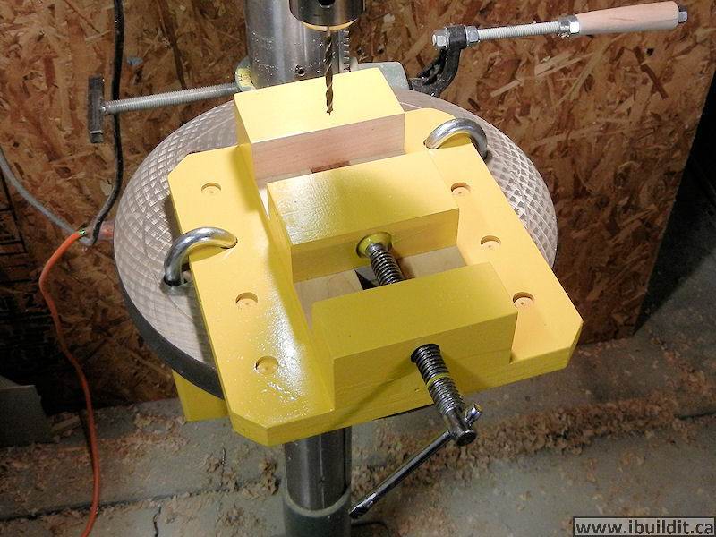 yellow paint on a wooden drill press vise finished
