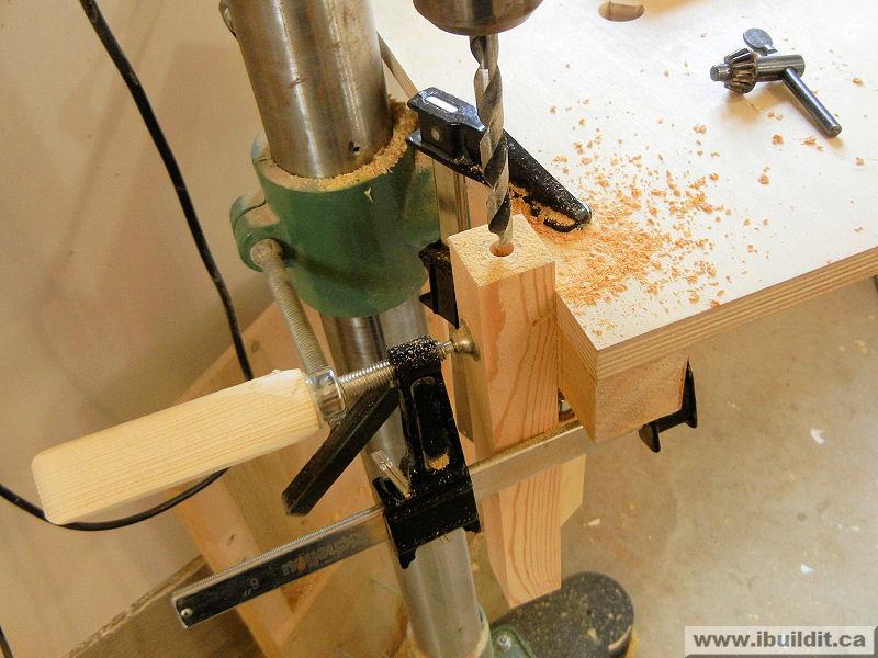 what should be done to stock material when drilling with a drill press?