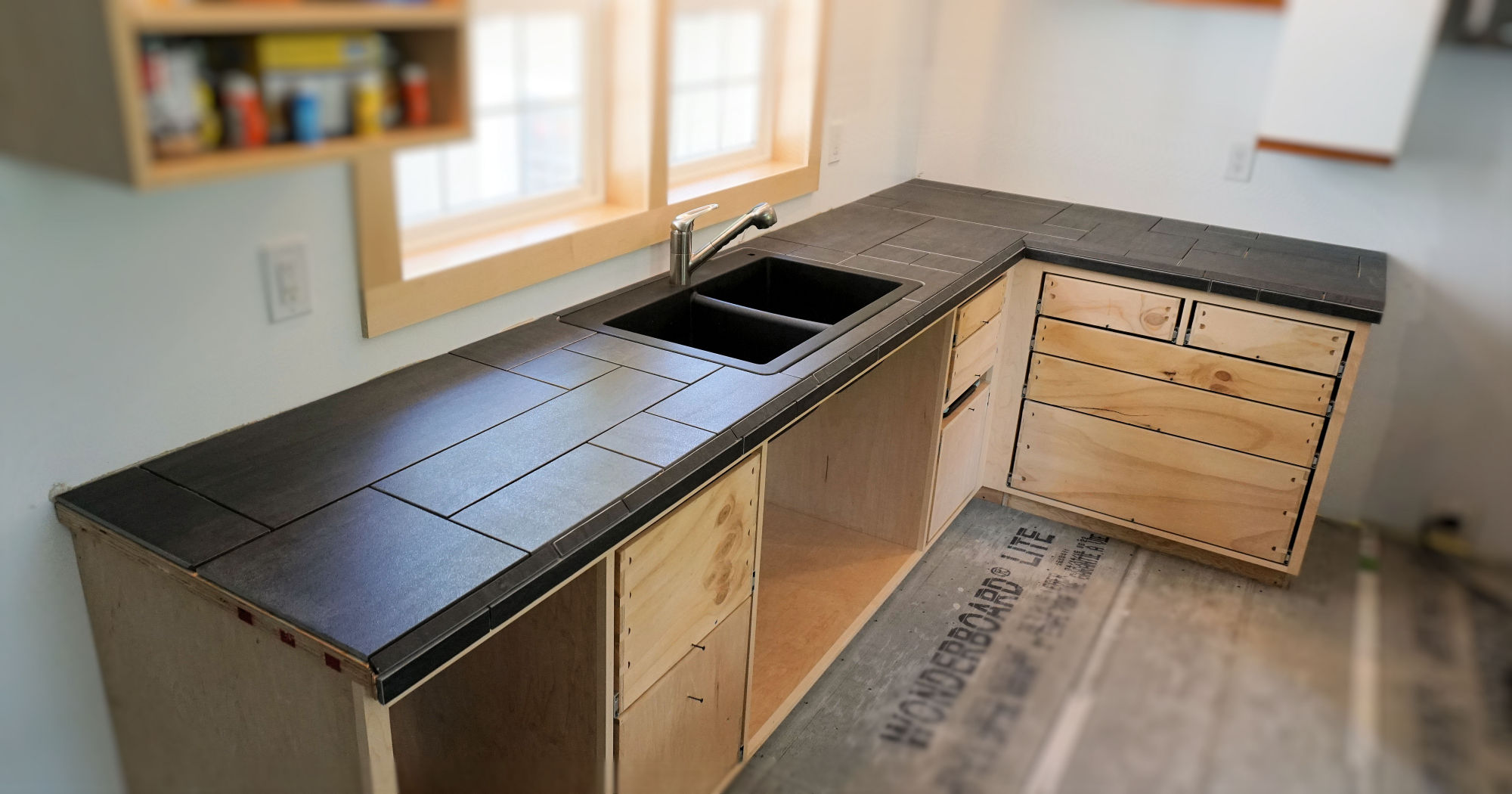 kitchen countertop that matches aqua tile wall